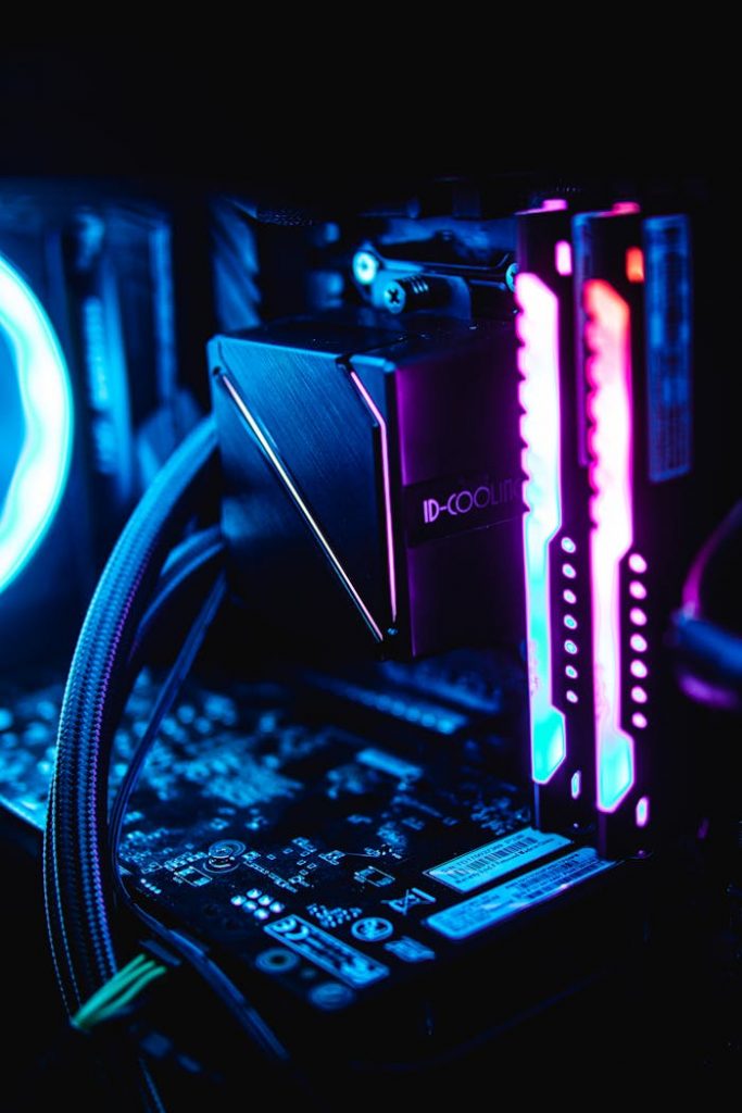 Crafting Captivating Headlines: Your awesome post title goes here Close-up of RGB-lit PC components showcasing vibrant blue and pink hues in a dark setup.